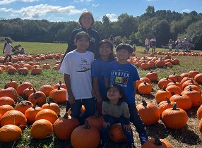 children in pumpkin patch